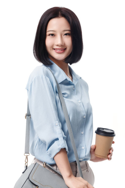 女白领手拿咖啡杯图片下载