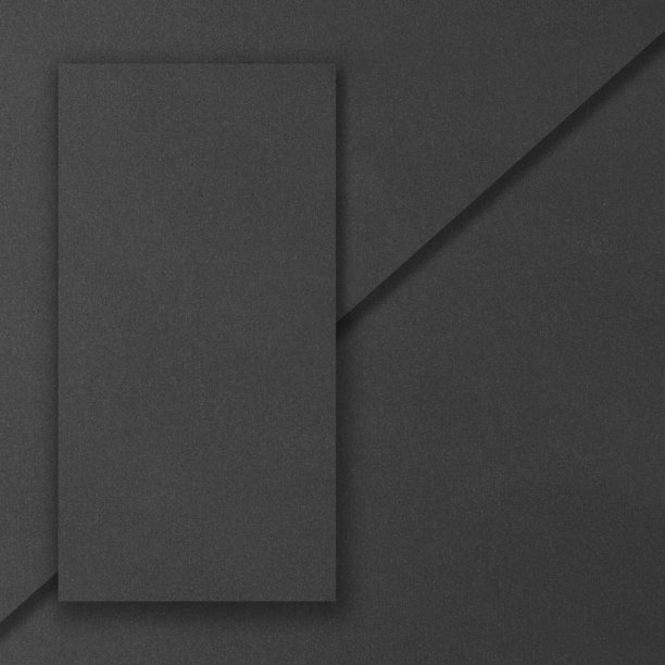 黑色矩形模型在黑暗的混凝土背景。设计元素或作品集。副本的空间。图片下载