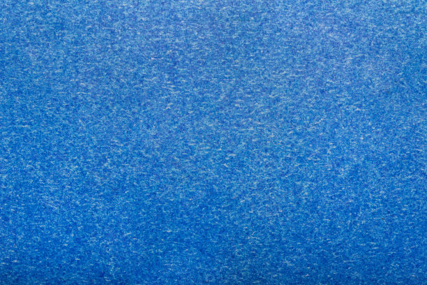 纹理背景照片的蓝色彩色纸表面。图片下载