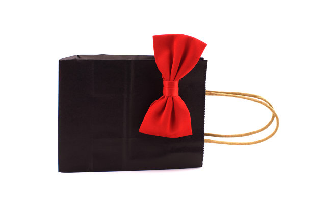 黑色纸袋与红色蝴蝶结图片下载
