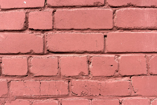 红砖墙凹凸不平。图片下载