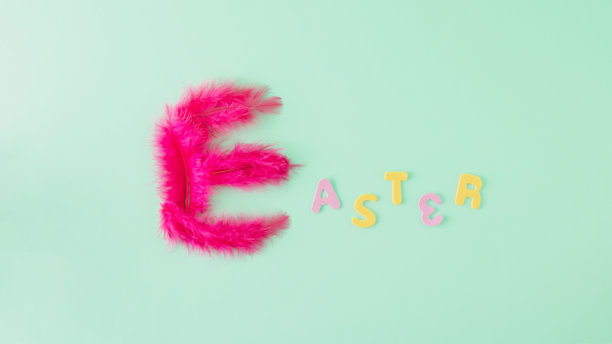 一种创造性的排列方式，在绿色的背景上，把字母塑造成复活节这个单词。最小的概念在柔和的颜色。图片下载