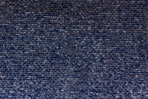 背景由天然和人造织物制成，用于纺织品、家具和服装的设计。家具生产。图片下载