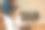 父子关系。非洲裔美国年轻人微笑着站在7-8岁男孩的后面，膝盖上放着笔记本电脑，指着屏幕，帮助他做作业图片下载