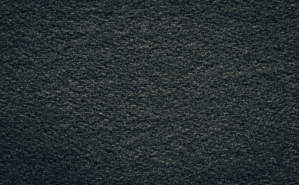 纹理黑色羊毛或深色粗花呢织物特写。图片下载
