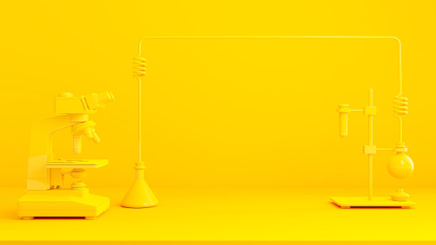 黄色背景下的黄色试管和显微镜。图片下载