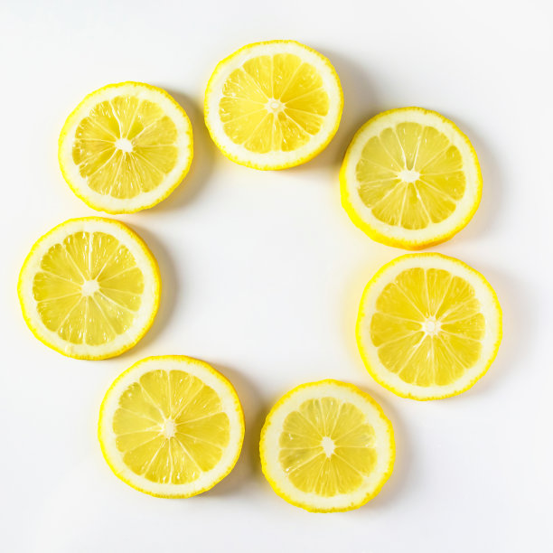 背景从新鲜多汁的柠檬特写。成熟的黄色柑橘的图案图片下载