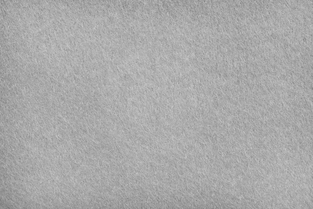 灰色毛毡纹理织物背景的特写。图片下载