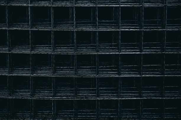 钢筋网是堆放在钢筋混凝土施工中使用的。钢材料以金属网的形式用于加固墙体、楼板、楼板和基础。抽象的背景图片下载