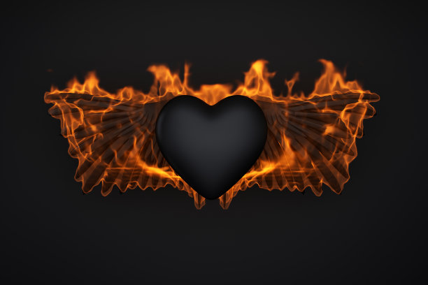 燃烧的鸟翅膀与黑色的心脏符号在黑色的背景图片下载