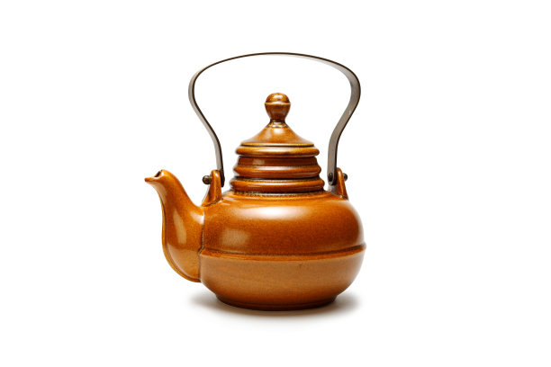 桌上有个古董陶瓷茶壶。图片下载