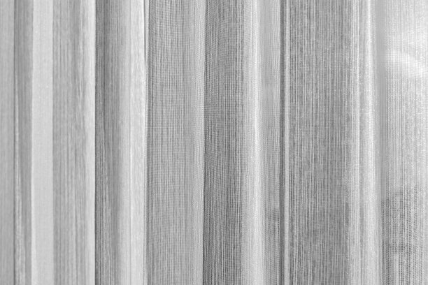 波浪白色薄纱窗帘。背景图片图片下载