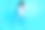 全长照片的年轻的快乐的女孩跳跃比赛训练足球孤立在蓝色的背景图片下载