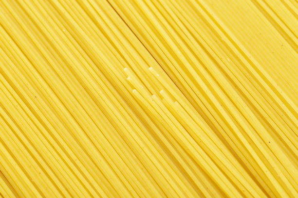 生意大利面的背景。天然传统的意大利美食。黄色的意大利面食。图片下载