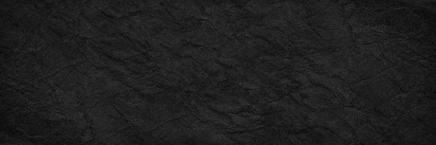 抽象的黑色背景。宽横幅。暗色岩石表面纹理。特写镜头。石头的背景图片下载