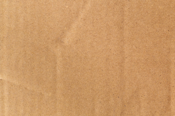 棕色的生态回收牛皮纸纹理被用来创建背景。图片下载