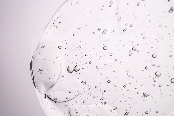 中性背景上厚厚的化妆品凝胶的纹理。图片下载