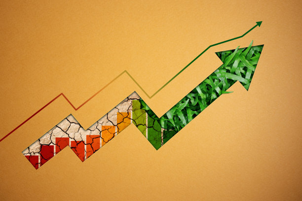 ESG，关爱环境的理念。剪纸向上箭头显示绿色的草，干裂的土地和图表下面。环境与商业共同成长。可持续的资源图片下载