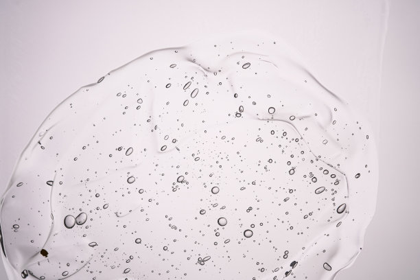 中性背景上厚厚的化妆品凝胶的纹理。图片下载