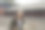 年轻的女摄影师在古城墙上行走的照片图片下载