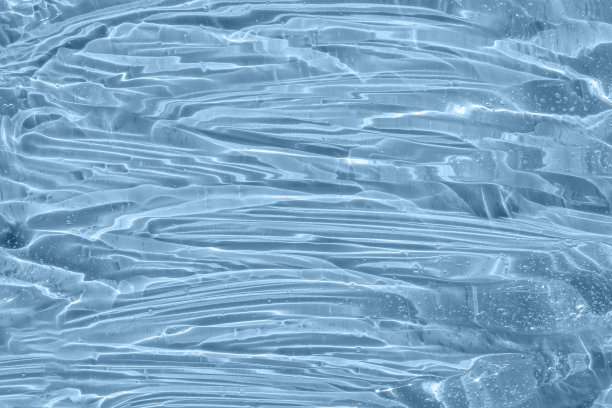 血清纹理，透明凝胶，气泡背景。护肤乳液面部产品样本。含有胶原蛋白和视黄醇的透明质酸，用于皮肤护理。蓝色美容化妆水。图片下载