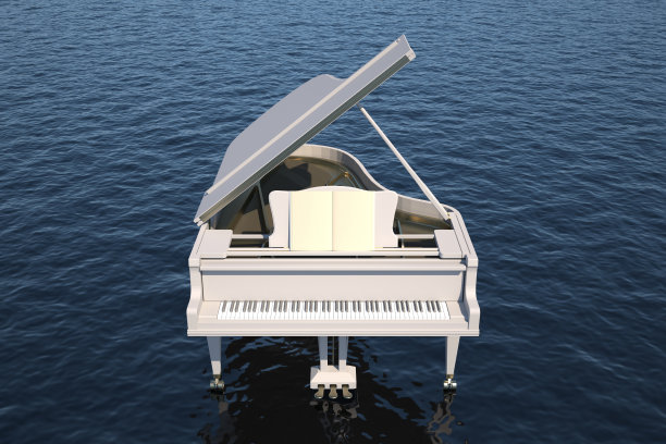 白色的钢琴在海洋里图片下载