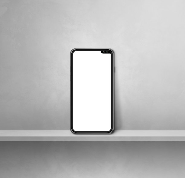 手机放在灰色的墙上架子上。广场背景图片下载