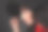 她是一个身材苗条的黑发女人，留着长长的卷发，化着漂亮的妆，穿着一件红色的外套。图片下载