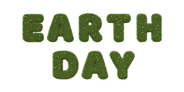 “地球日”文字由绿色的草地上点缀着蒲公英，孤立在白色上。图片下载