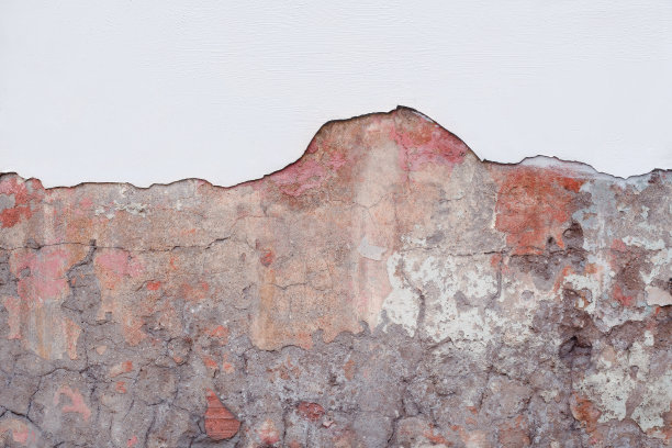 带有污迹和碎屑的旧石墙碎片。图片下载