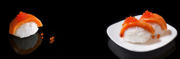 黑色宽屏背景的三文鱼和鱼子酱寿司。有选择性的重点。横幅、烹饪概念图片下载