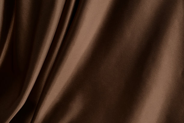 棕色的丝绸,缎。美丽的背景与织物巧克力色。棕色织物，窗帘，褶皱，窗帘图片下载