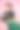 年轻有吸引力的女人持有电影拍板。十几岁的女孩在一件蓝色的衬衫和眼镜拿着经典的黑色电影制作clapper野猪在粉红色的背景图片下载