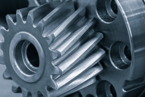传动齿轮零件特写镜头。汽车传动系统齿轮部分的抽象场景。工业概念背景图片下载
