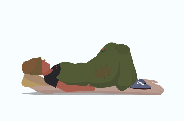 一个裹着毯子的乞丐睡在街上图片下载