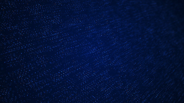 彩色粒子隔离在蓝色背景。图片下载