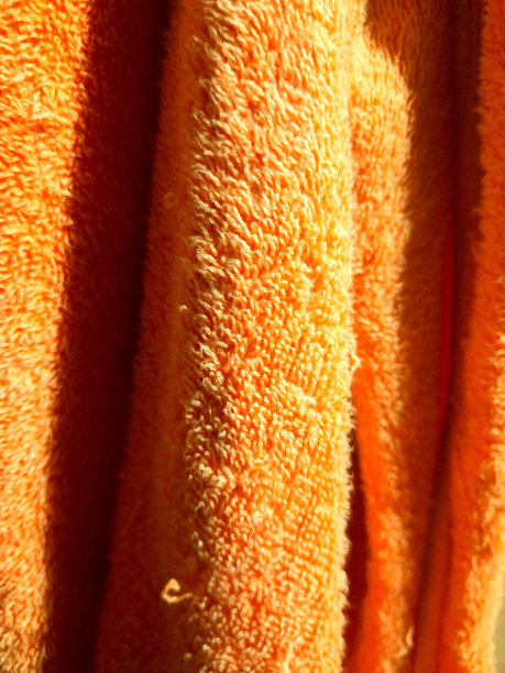 橙色浴巾的质地图片下载
