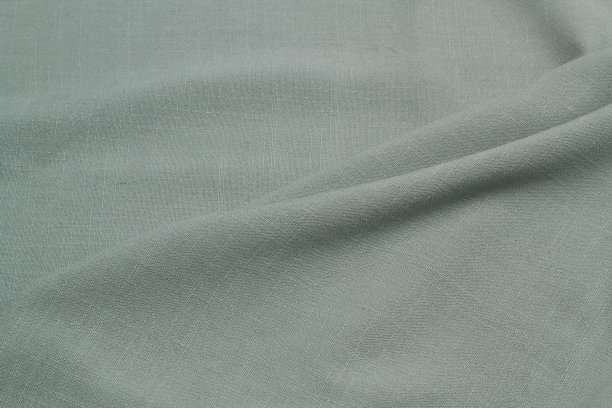 五彩缤纷的织物堆叠在一起。五彩缤纷的棉纺织品。图片下载