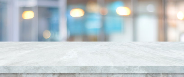 空的白色桌面，柜台，书桌上模糊透视商店与散景光背景，白色大理石石桌子，货架和模糊的商店食品，产品展示模型，模板背景，横幅，零售业务墙纸，海报图片下载