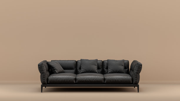 黄色空墙前的单色黑色沙发室内图片下载