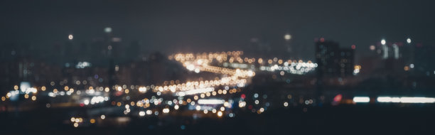 模糊的道路交通在夜间，抽象的城市景观背景图片下载