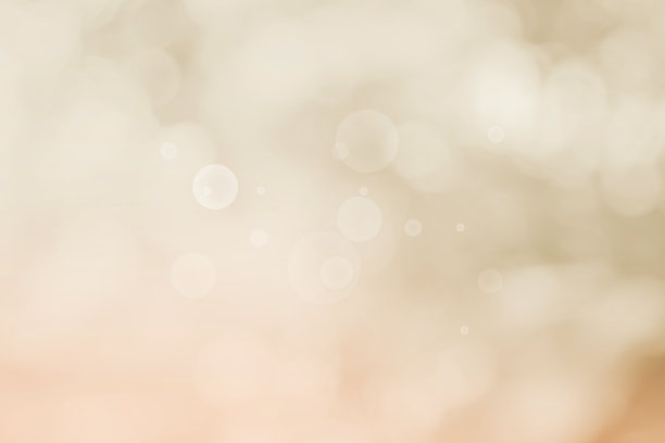 摘要模糊的奶油色为背景，模糊的节日灯光为室外庆祝活动和白色散景聚焦纹理装饰设计优雅的赢家。图片下载