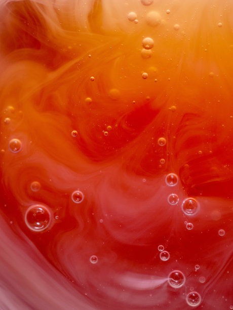 黄色和橙色的背景泡沫和液体肥皂的模式，垂直图像，微距照片，极端近图片下载