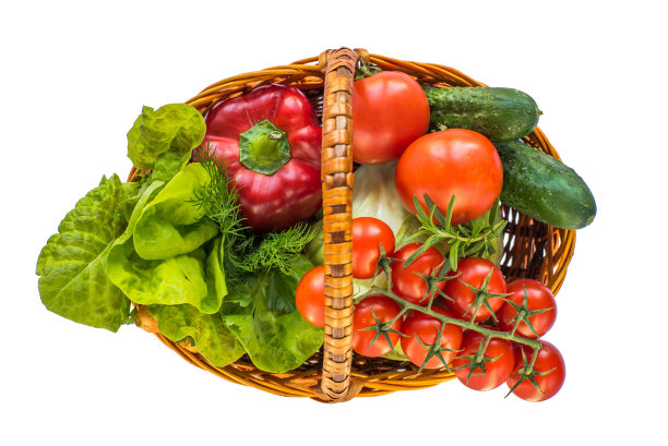 不同的蔬菜在一个篮子上的白色背景俯视图。维生素复杂。自制的食物。生态产品。图片下载