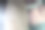 一个家庭主妇手里拿着一个热气腾腾的熨斗。洗衣女工正在烫衣服。现代生活方式的概念，一个在家熨衣服的女人图片下载
