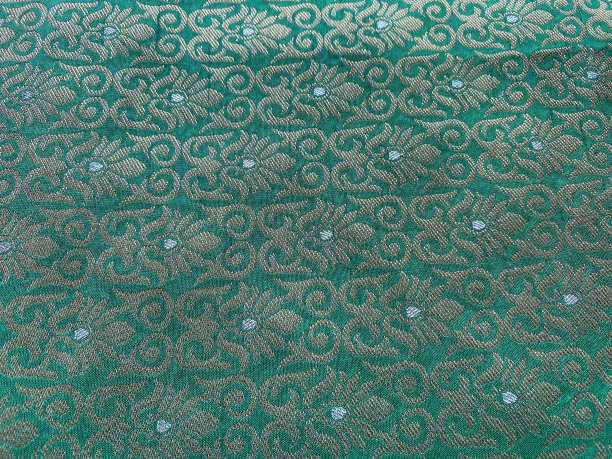 绿色棉织物上的刺绣图片下载