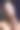 美丽的黑发女人肖像在黑色背景和孔雀羽毛耳环图片下载