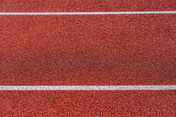 红色田径跑道的纹理与白线图片下载
