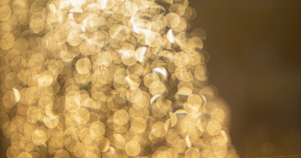 金色散焦闪光，抽象背景与黄色热散焦图片下载