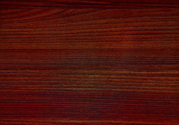 抽象的木材纹理。表面柚木背景深红色，用于设计和装饰。用于室内装饰的木质复合材料。人造木材用作背景。图片下载